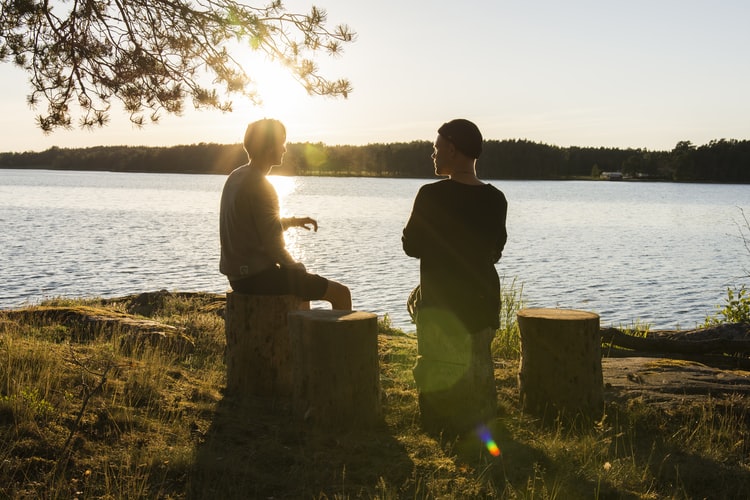 Two people having conversation outside
