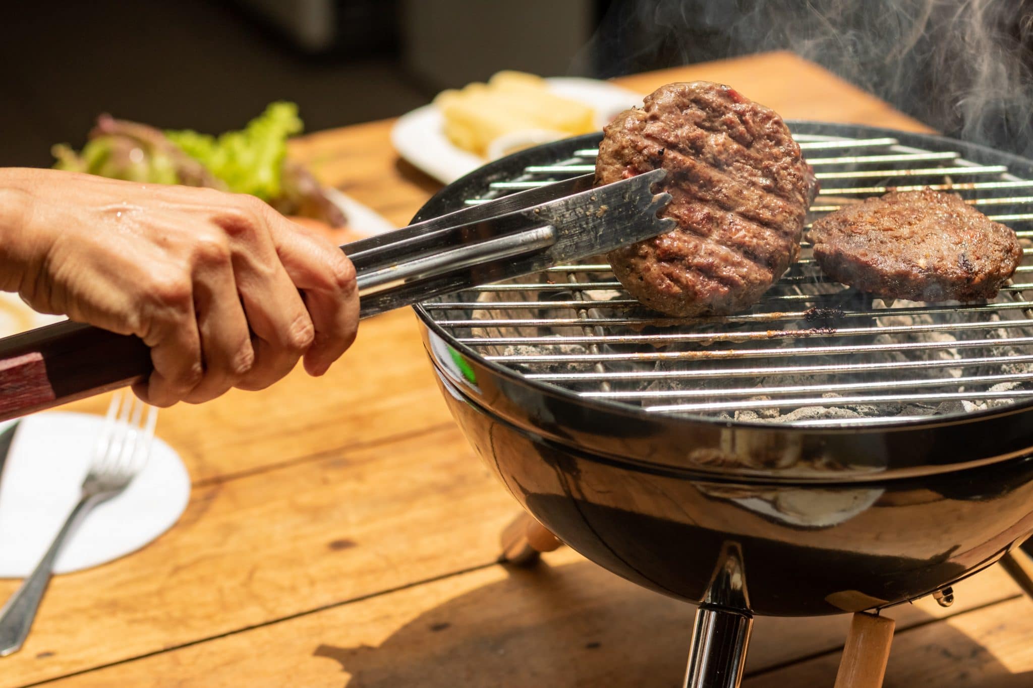 Grilling burger patties.