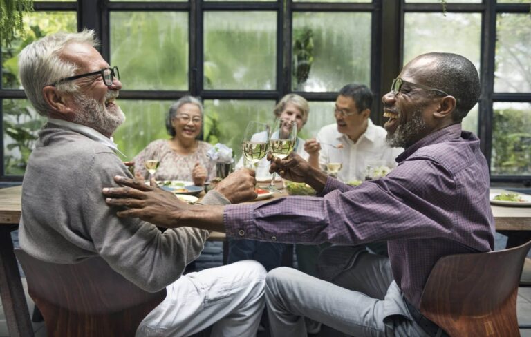 friends-dinner Group of older friends enjoying a meal together.